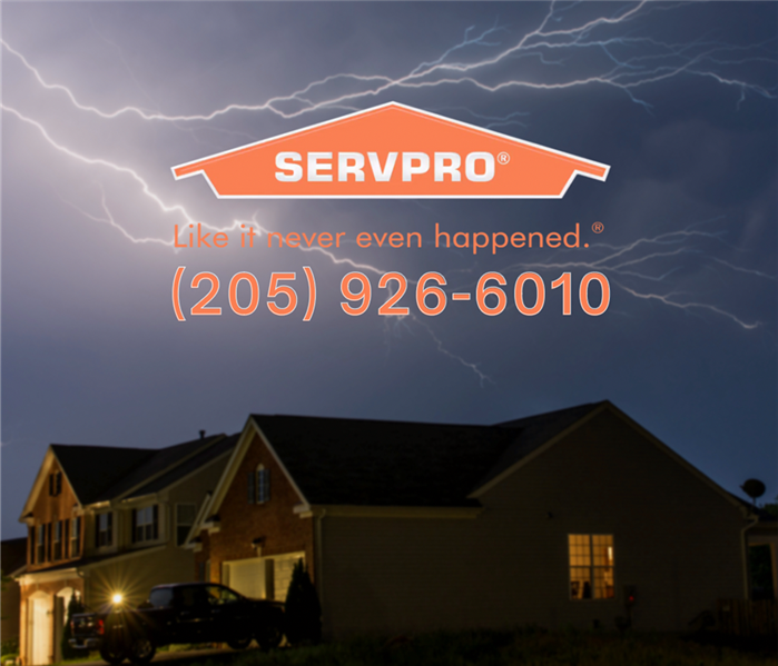 Lightening striking over a residential home with the SERVPRO logo at the top and our phone number: 205-926-6010.
