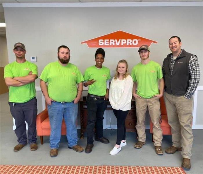 A group of Servpro workers smiling at the camera.